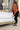 lady fixing bed cover